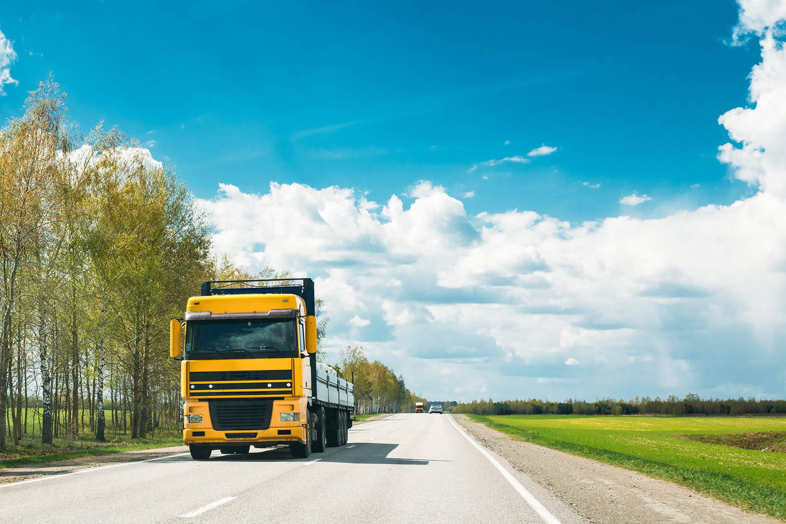 Truck In Motion On Country Road. Motion Cars On Freeway In Europ